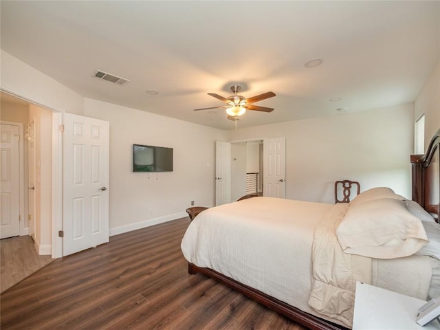 bedroom featuring dark hardwood / wood-style flooring and ceiling fan