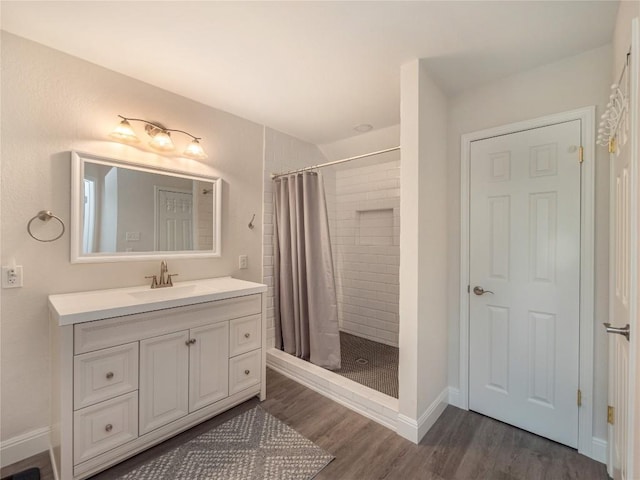 bathroom featuring vanity, a shower with curtain, and hardwood / wood-style flooring