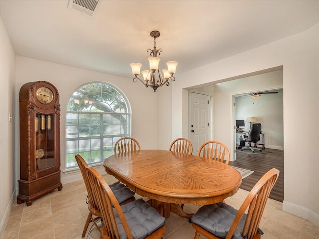 dining space with a notable chandelier