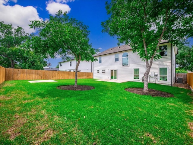 view of yard featuring cooling unit and a patio area