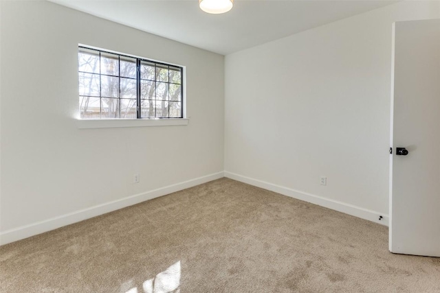 unfurnished room with light carpet