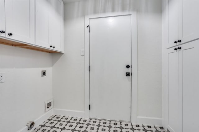 laundry area with cabinets and electric dryer hookup