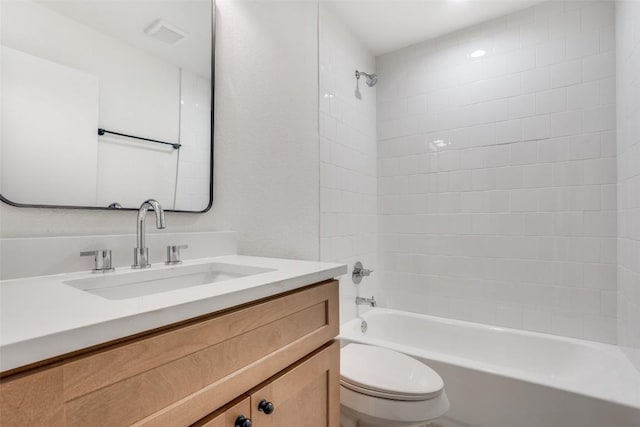 full bathroom featuring vanity, toilet, and washtub / shower combination