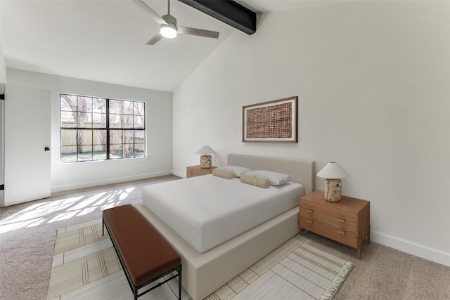 bedroom with light colored carpet, ceiling fan, and lofted ceiling with beams