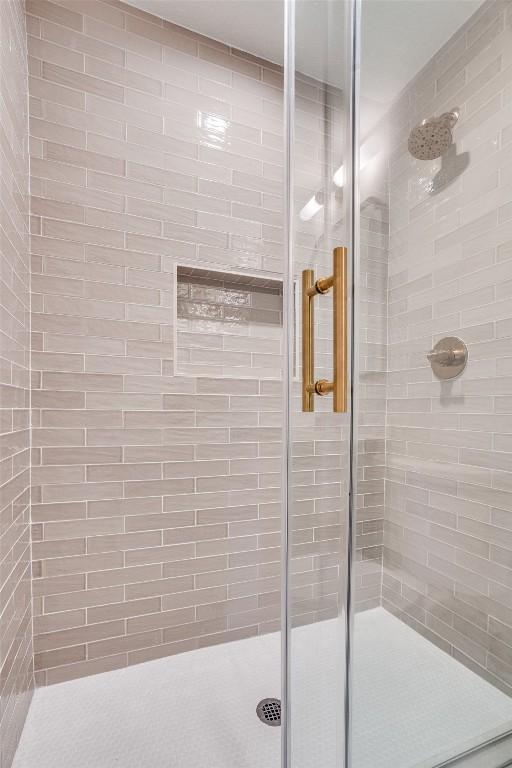 bathroom with an enclosed shower