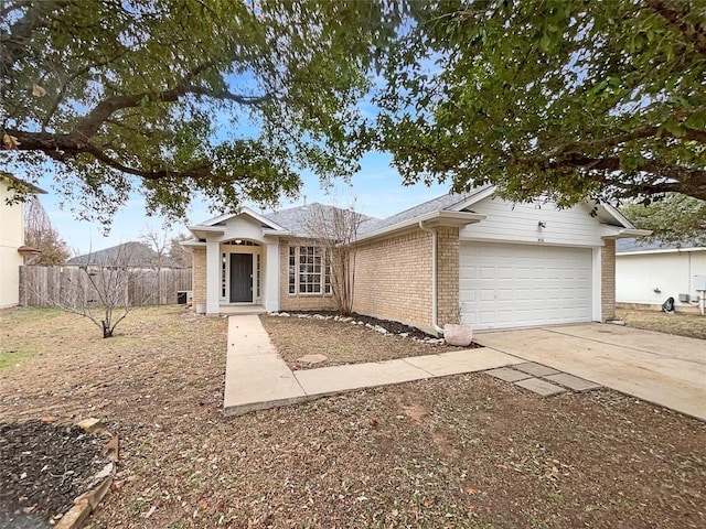 ranch-style home featuring a garage