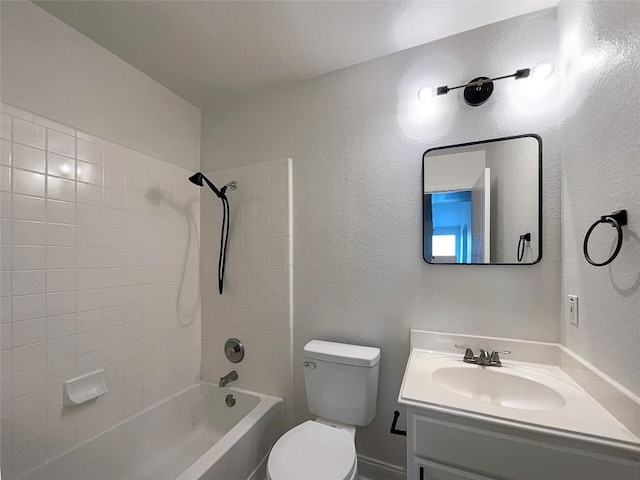 full bathroom featuring vanity, toilet, and tiled shower / bath combo