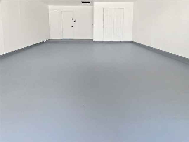 1406 Rio Bravo Loop, Leander, TX 78641 - garage featuring baseboards
