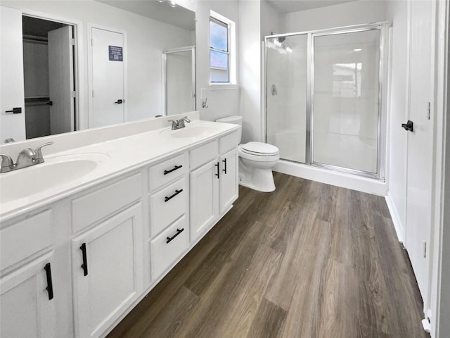 1406 Rio Bravo Loop, Leander, TX 78641 - full bath with a stall shower, double vanity, and wood finished floors