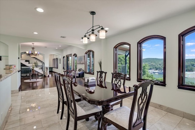 dining area featuring a notable chandelier