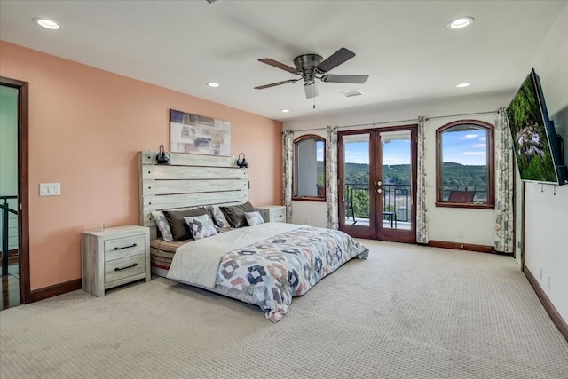 bedroom with french doors, ceiling fan, light colored carpet, and access to outside