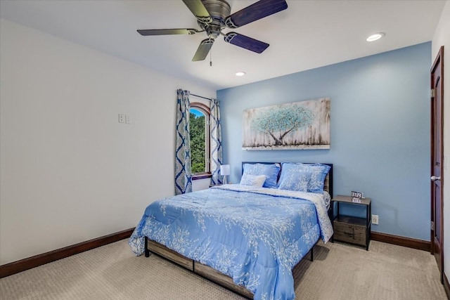 carpeted bedroom featuring ceiling fan