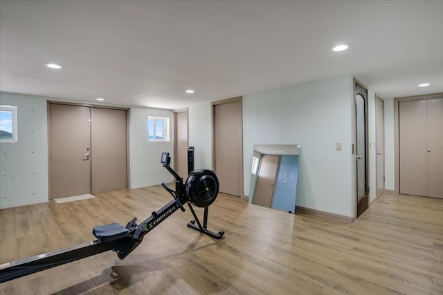 exercise area featuring light hardwood / wood-style floors