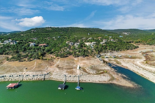 birds eye view of property featuring a water and mountain view