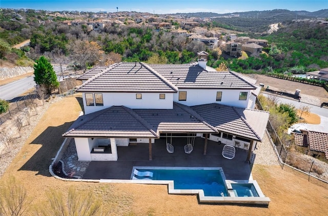 rear view of property with a patio area