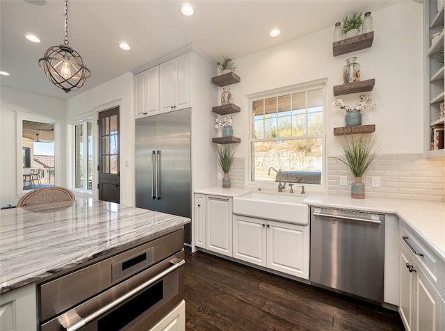 102 Canyon Turn Trl, Austin, TX 78734 - kitchen with open shelves, decorative backsplash, stainless steel appliances, and a sink