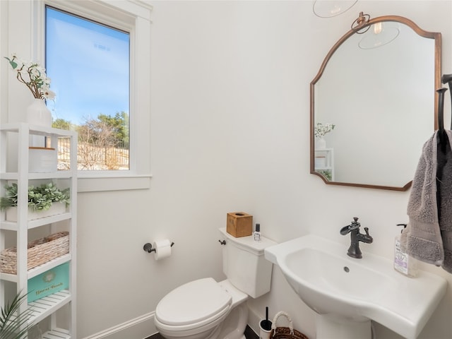 102 Canyon Turn Trl, Austin, TX 78734 - half bathroom with toilet, baseboards, and a sink