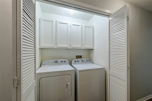 laundry area featuring cabinets and washer and dryer