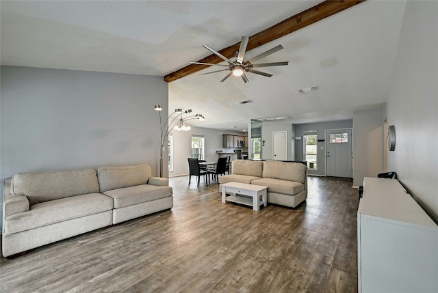 living room with wood-type flooring, lofted ceiling with beams, and ceiling fan