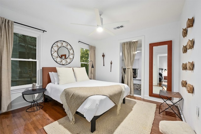 bedroom featuring hardwood / wood-style flooring and ceiling fan