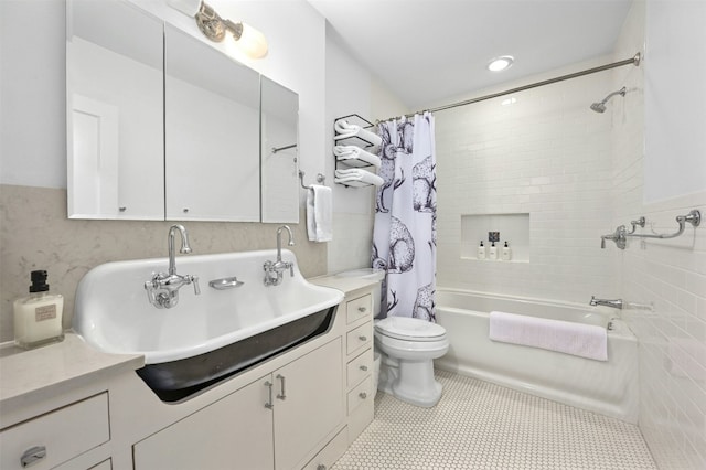 full bathroom with shower / bath combination with curtain, tile patterned floors, vanity, and toilet