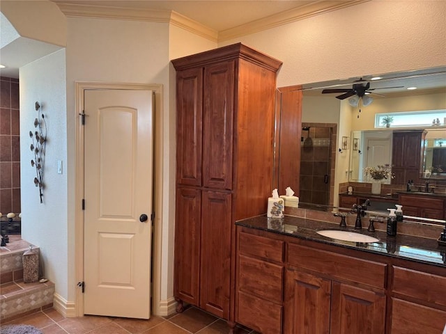 bathroom featuring tile patterned flooring, vanity, crown molding, and ceiling fan