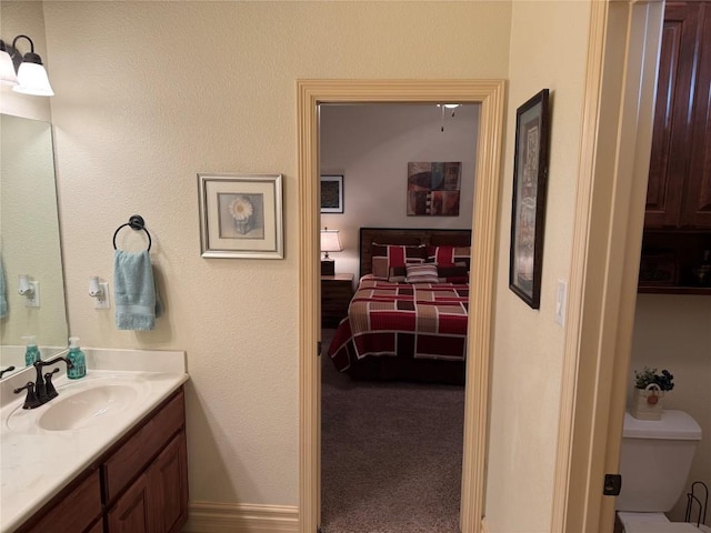 bathroom with vanity and toilet