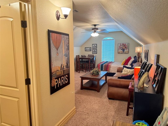 carpeted living room with ceiling fan, lofted ceiling, and a textured ceiling