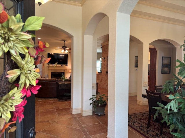 hall featuring ornamental molding and tile patterned floors