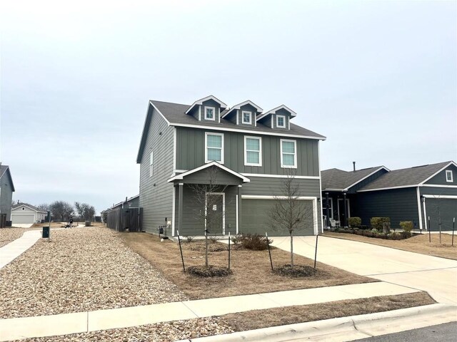 155 Citrine Crst, Maxwell, TX 78656 - view of front facade featuring concrete driveway, board and batten siding, and an attached garage