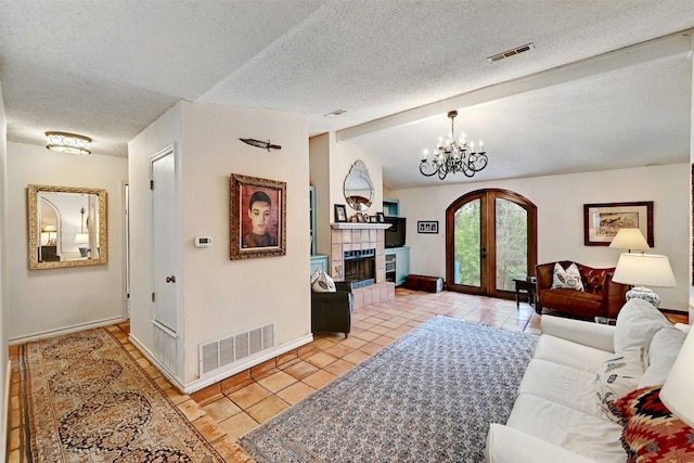 living area with french doors, visible vents, vaulted ceiling with beams, and light tile patterned floors