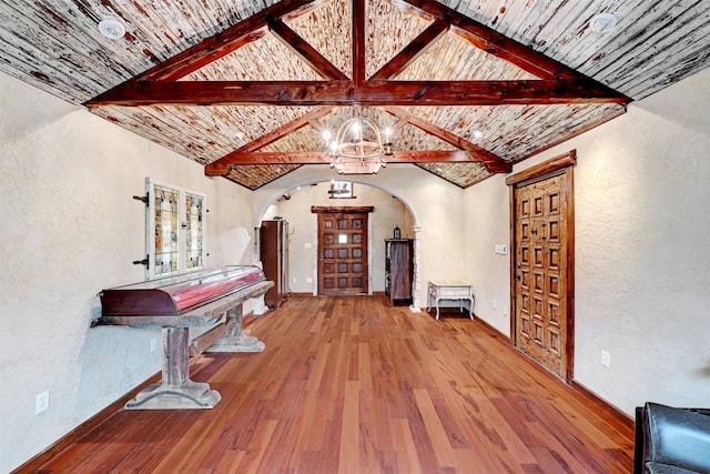 107 S Cuernavaca Dr, Austin, TX 78733 - living area featuring arched walkways, wood-type flooring, and a textured wall