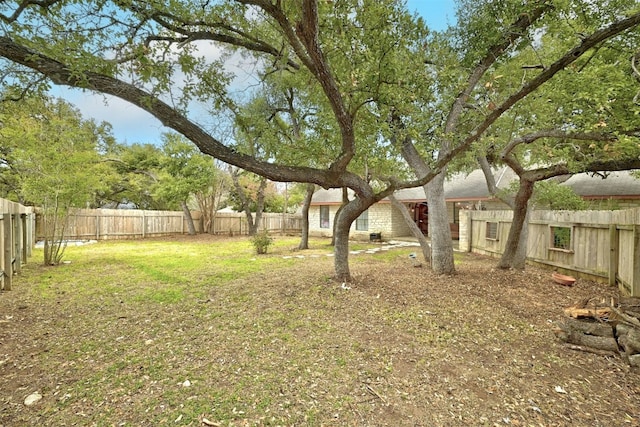 view of yard with a fenced backyard