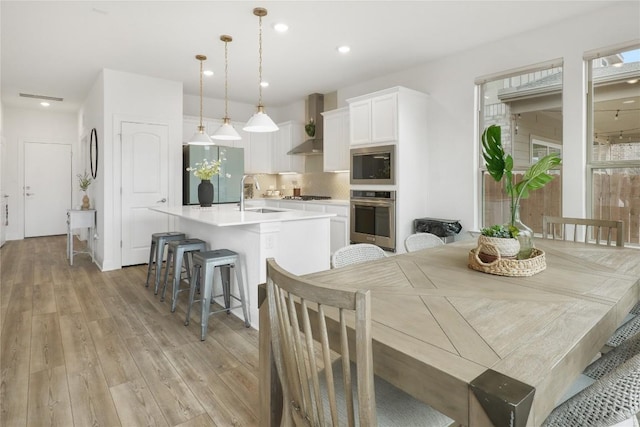 821 Olinda Way, Liberty Hill, TX 78642 - dining space featuring light wood finished floors and recessed lighting