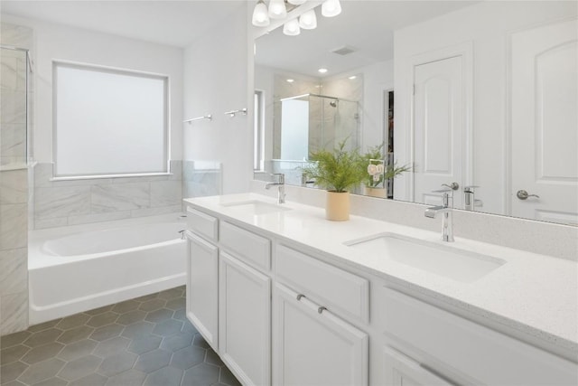 821 Olinda Way, Liberty Hill, TX 78642 - bathroom featuring a shower stall, double vanity, a garden tub, and tile patterned floors