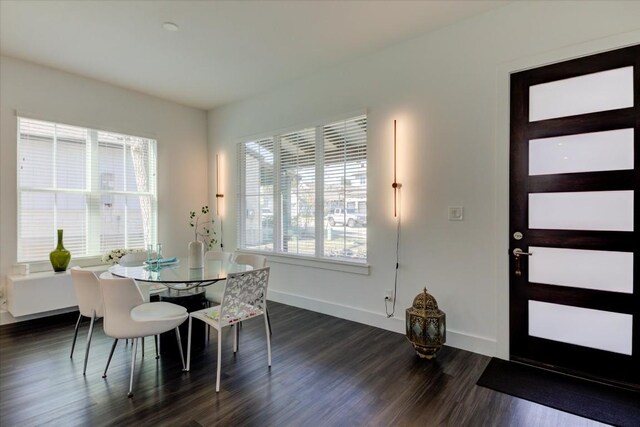 dining area featuring dark hardwood / wood-style flooring