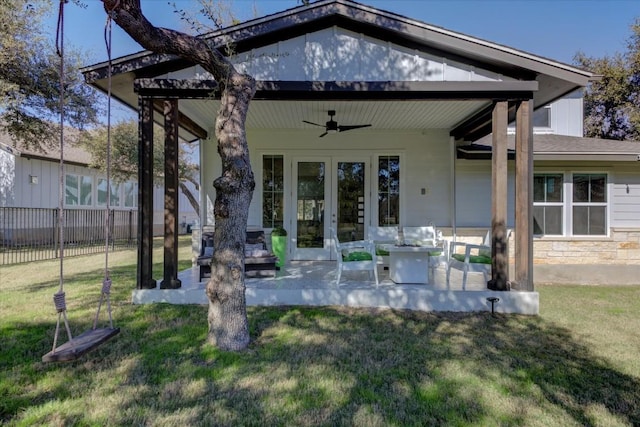 back of house with a patio area, french doors, ceiling fan, and a lawn