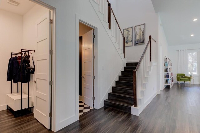 staircase featuring wood-type flooring