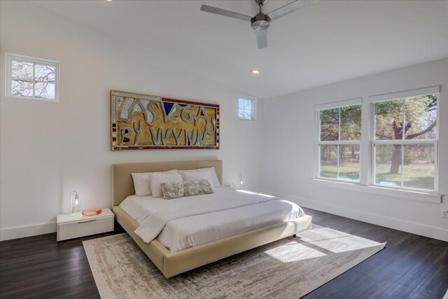 bedroom featuring vaulted ceiling, dark wood-type flooring, and ceiling fan