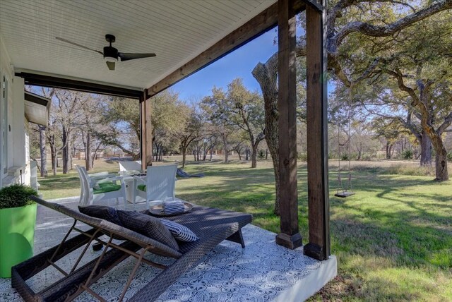 view of yard with ceiling fan and a patio area