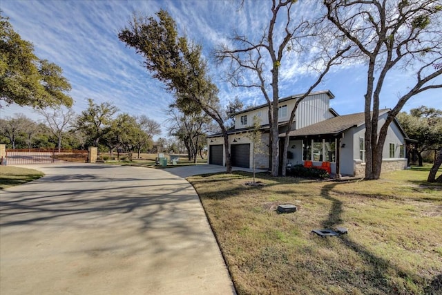 view of front facade with a garage and a front lawn