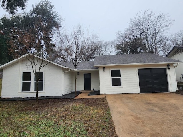 ranch-style house featuring a garage