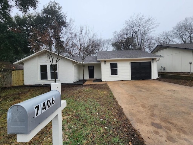 single story home with a garage