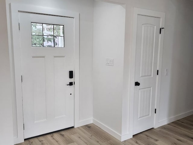 foyer entrance with light wood-type flooring