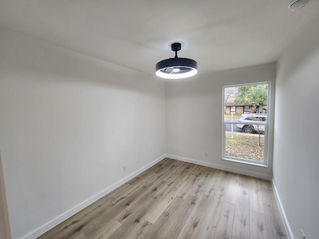 spare room featuring light hardwood / wood-style flooring