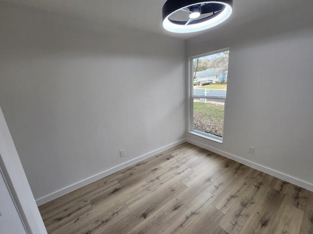 spare room featuring light hardwood / wood-style floors