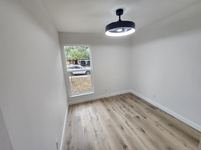 unfurnished room with light hardwood / wood-style flooring