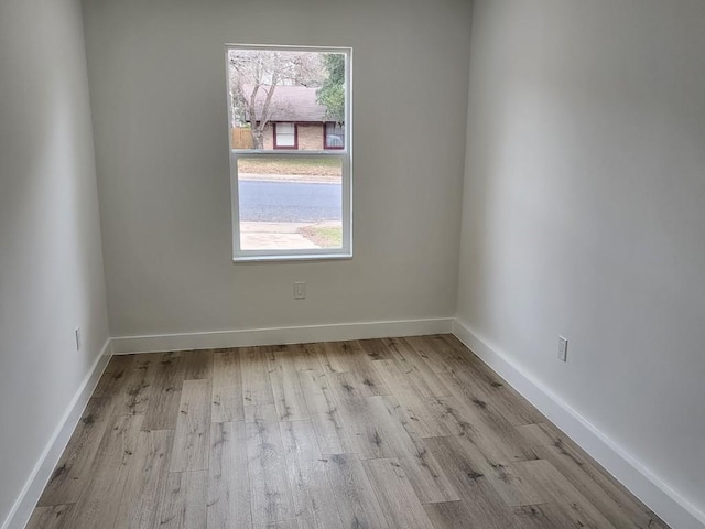 unfurnished room featuring light wood-type flooring