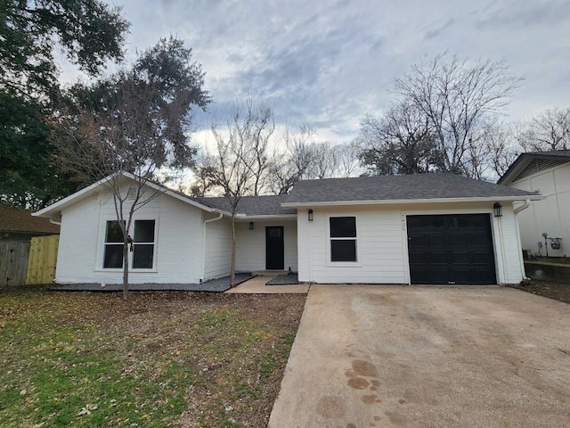 ranch-style house featuring a garage