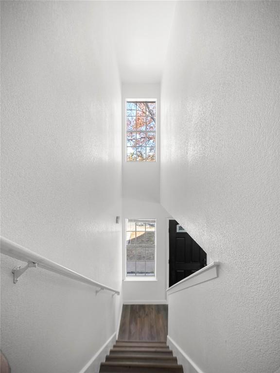 stairs with wood-type flooring